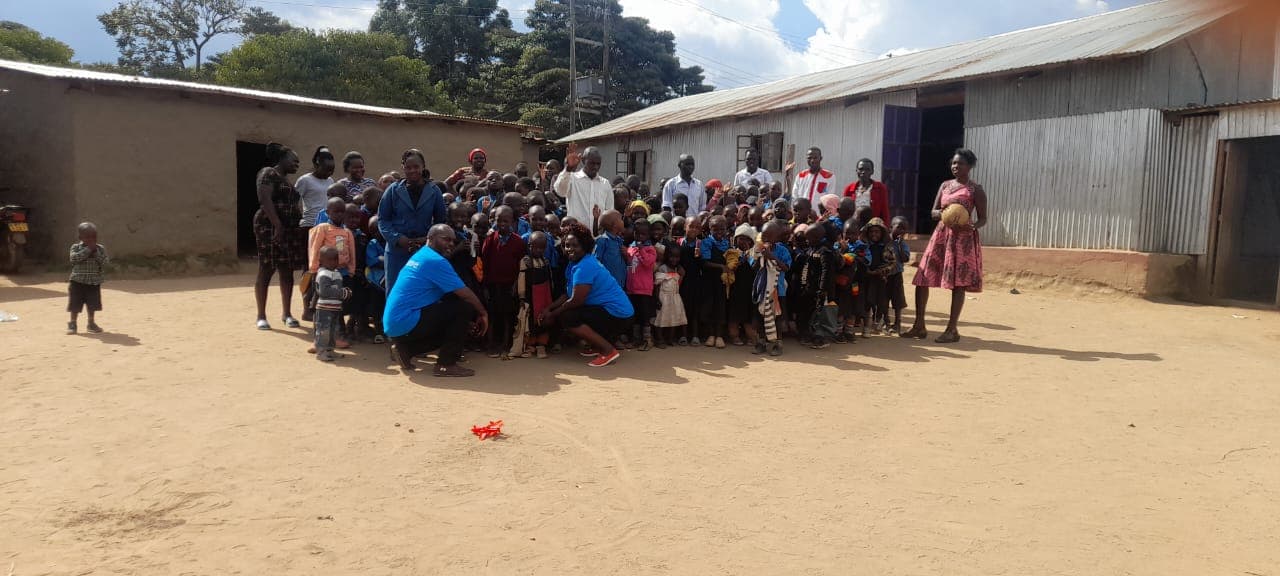 Pupils and teachers outside class at Kahuho Word of Life